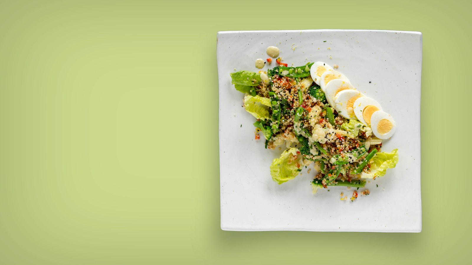 Plate of leafy greens and sliced eggs rich in folate and choline that support healthy methylation